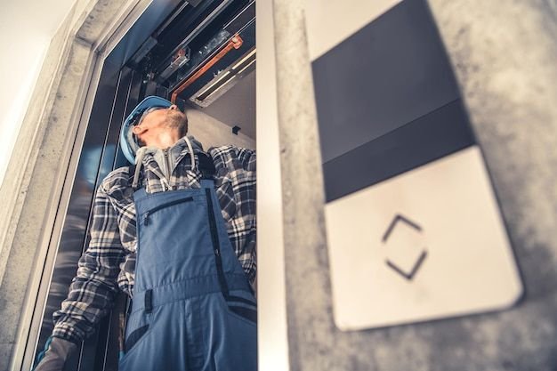 Home elevator doors repair performed by professional technician premium photo